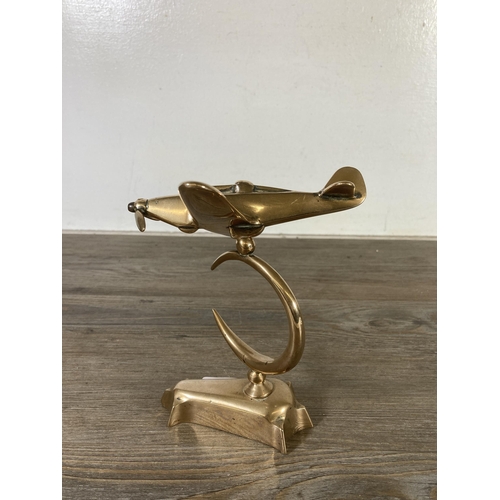 508 - A mid 20th century brass model of a spitfire