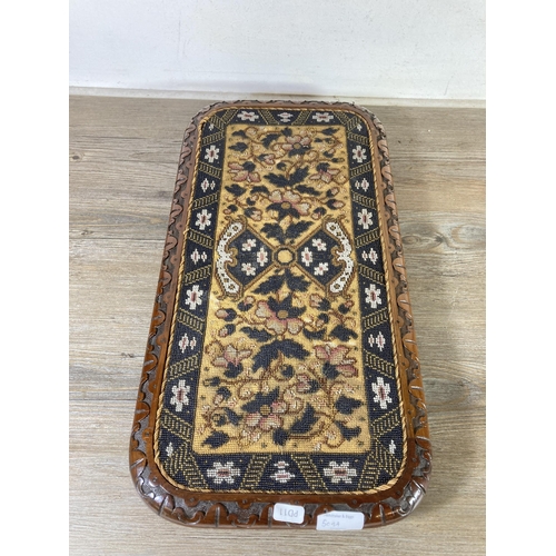 509A - A Victorian carved mahogany and floral beadwork tray - approx. 54cm x 28cm