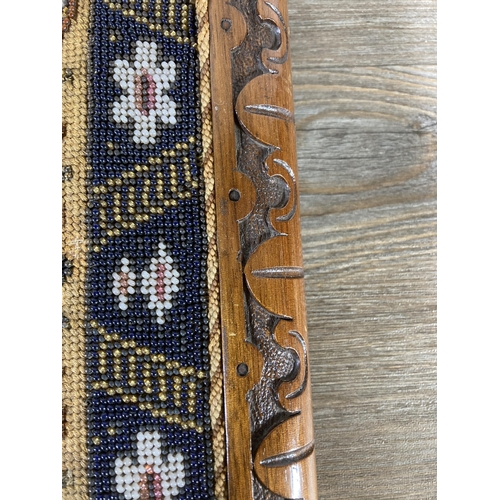 509A - A Victorian carved mahogany and floral beadwork tray - approx. 54cm x 28cm