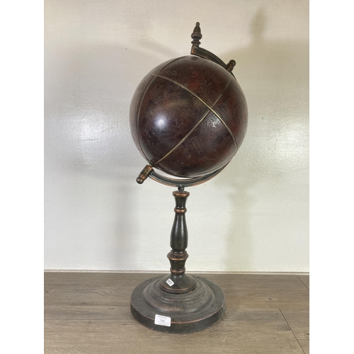 510 - A 19th century style faux leather floor standing globe - approx. 75cm high