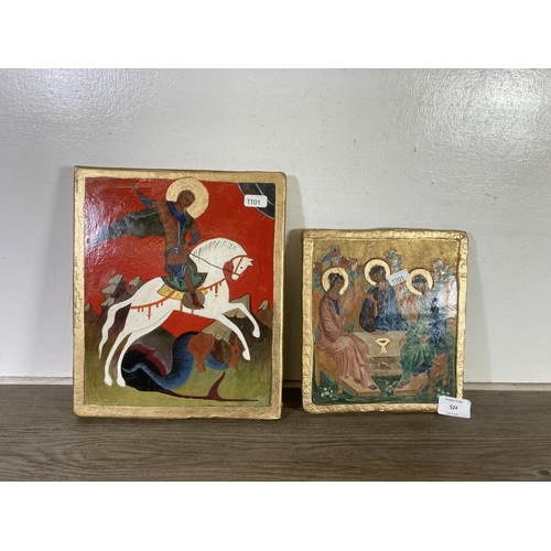 524 - Two hand painted wooden religious icon plaques - largest approx. 28cm x 23cm