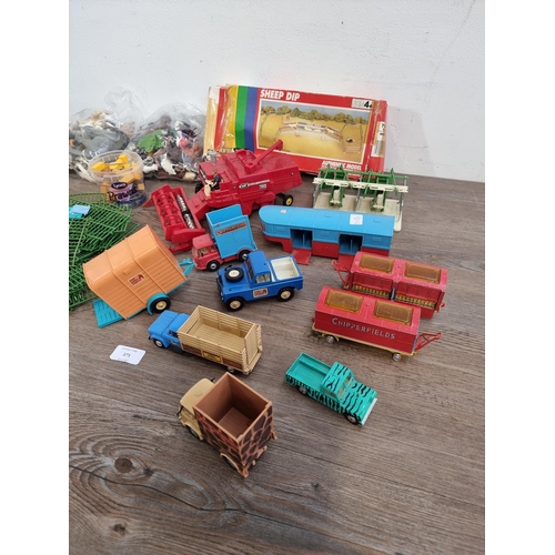 371 - Two bags containing toys to include Britains Ltd. and Corgi farm vehicles, Britains farm animals, sa... 