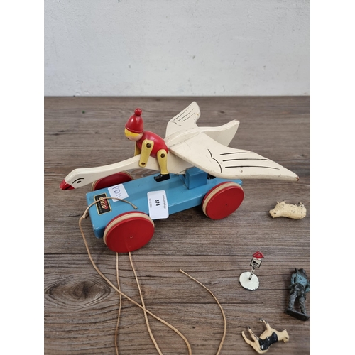 374 - Two items, one Brio pull-along wooden swan with rider and one bag containing toy cars and lead anima... 