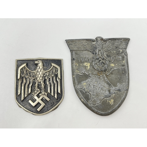 1164 - Two pieces of WWII German militaria, one pith helmet badge and one Crimea Shield