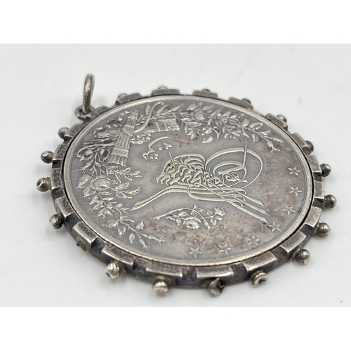 1165 - An 1891 Egyptian 20 Qirsh .833 silver coin pendant - approx. gross weight with mount 34.84 grams and... 