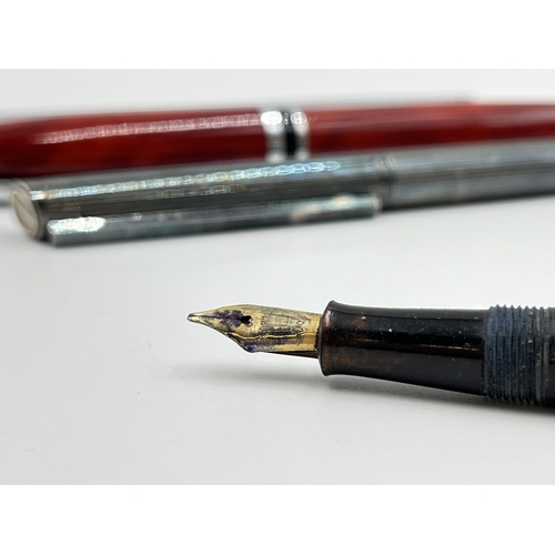 1173 - Four writing instruments to include Burnham fountain pen with 14ct gold nib, Mont Blanc ballpoint pe... 