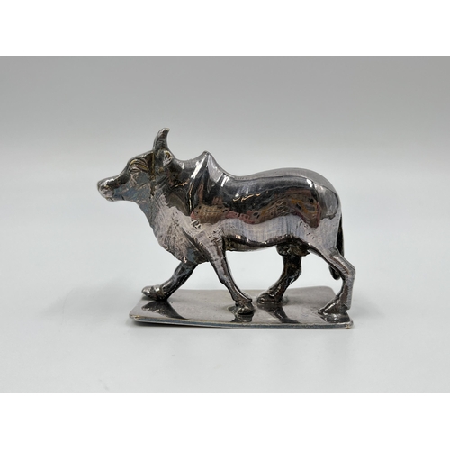 1313 - A white metal model of a buffalo - approx. gross weight 156 grams and 6cm high x 8cm long x 3cm wide