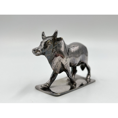 1313 - A white metal model of a buffalo - approx. gross weight 156 grams and 6cm high x 8cm long x 3cm wide