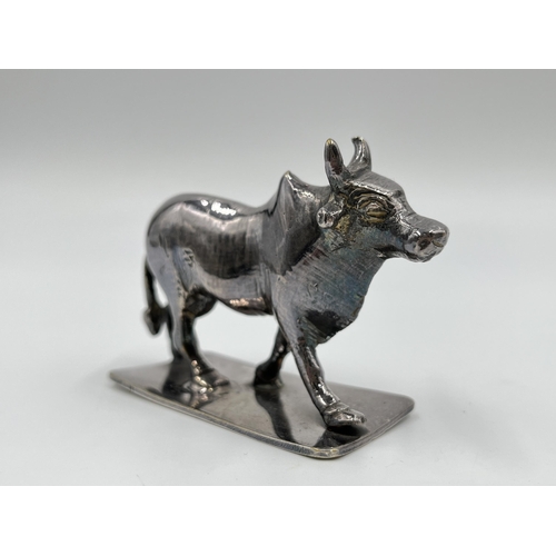 1313 - A white metal model of a buffalo - approx. gross weight 156 grams and 6cm high x 8cm long x 3cm wide