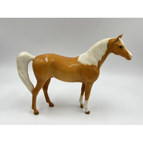 174 - A Beswick Palomino horse - approx. 16cm high x 21cm long