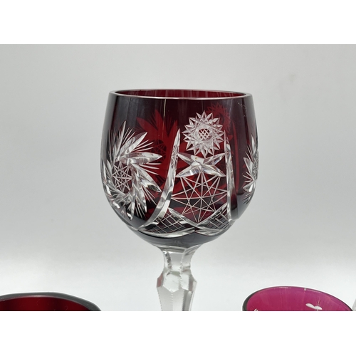 227 - Five pieces of cranberry glassware - largest approx. 18cm high