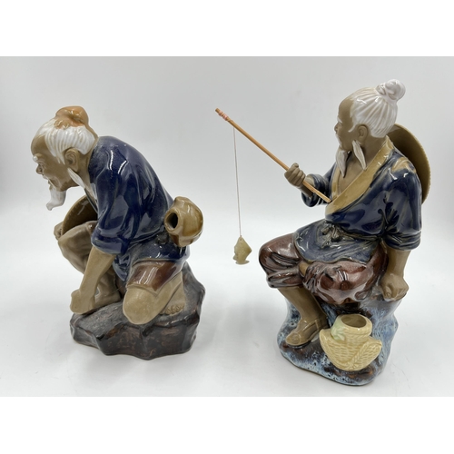 242 - Two Chinese Mud Man figurines - largest approx.  19cm