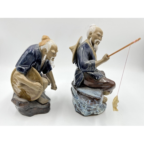 242 - Two Chinese Mud Man figurines - largest approx.  19cm