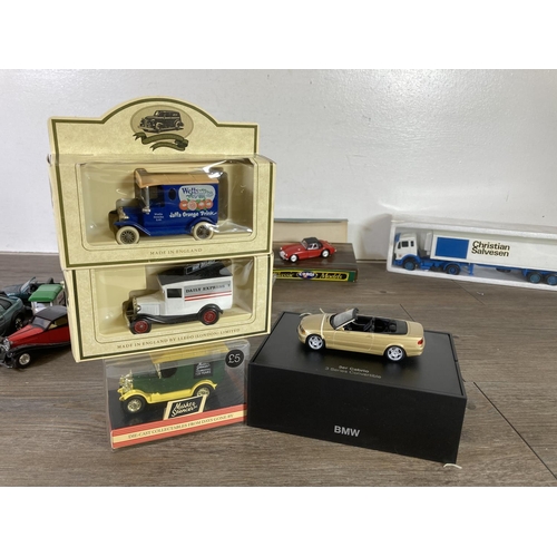 394 - A collection of toys to include boxed B.M.W. 3 Series convertible, boxed NZG Christian Salversen lor... 