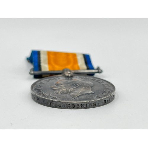 1159B - A WWI medal pair presented to 24295 PTE F.J Robbins Royal Warwickshire