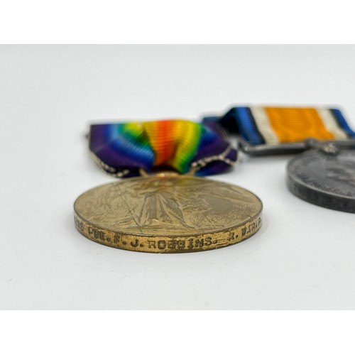 1159B - A WWI medal pair presented to 24295 PTE F.J Robbins Royal Warwickshire