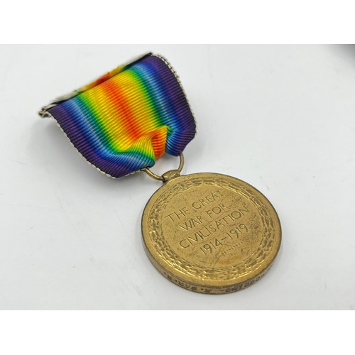 1159B - A WWI medal pair presented to 24295 PTE F.J Robbins Royal Warwickshire