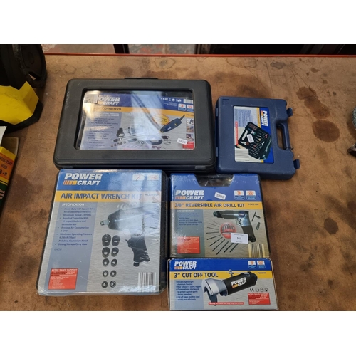 561 - Five Power Craft cased and boxed tools to include New Air impact wrench kit, 3/8