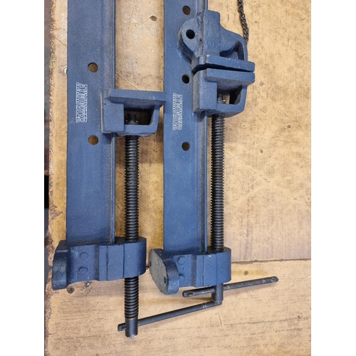 593 - Two Axminster cast iron sash clamps - approx. 83cm long