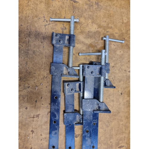 594 - Four cast metal G clamps - approx. 106cm long