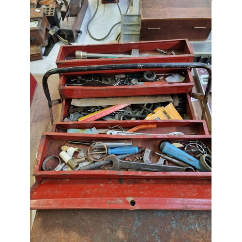 600 - Two vintage metal cantilever tool chests containing a large collection of tools