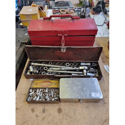 601 - A vintage metal cantilever tool chest containing vintage metal cased socket set etc.