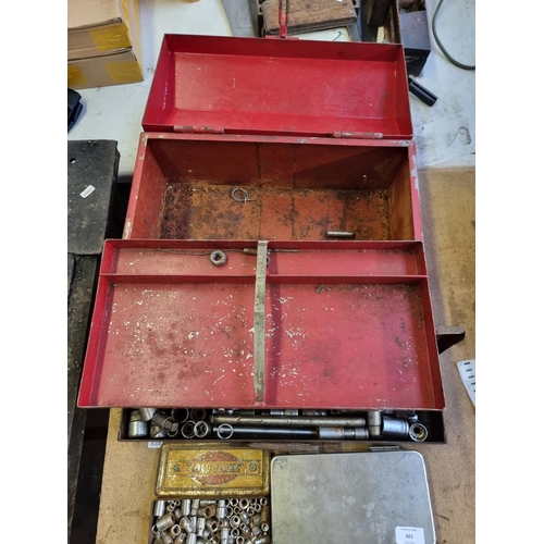 601 - A vintage metal cantilever tool chest containing vintage metal cased socket set etc.