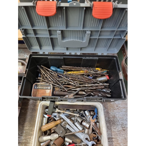 608 - Two boxes containing tools to include drill bits, spanners, screwdrivers etc.