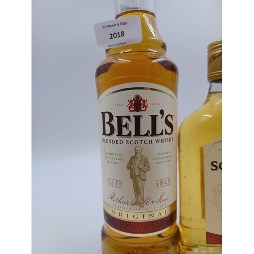 557 - Three bottles of blended Scotch whisky, one 70cl Bell's - bottled at 40%, one 35cl Asda - bottled at... 