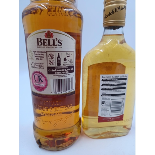 557 - Three bottles of blended Scotch whisky, one 70cl Bell's - bottled at 40%, one 35cl Asda - bottled at... 