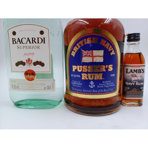 569 - Three bottles of rum, one 75cl Barbadian Pusser's Navy - bottled at 42%, one 35cl Bacardi Carta Blan... 