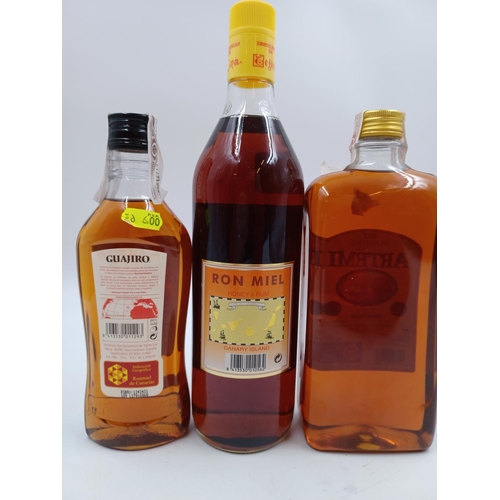 578 - Three bottles of honey rum liqueur, one 1L Artemi, one 1L Las Colmenas and one one 50cl Guajiro - al... 