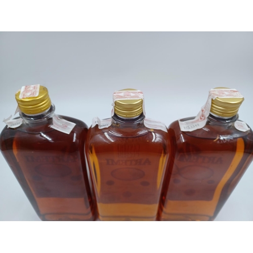 579 - Three 1L bottles of Canarian Artemi honey rum liqueur - bottled at 20%