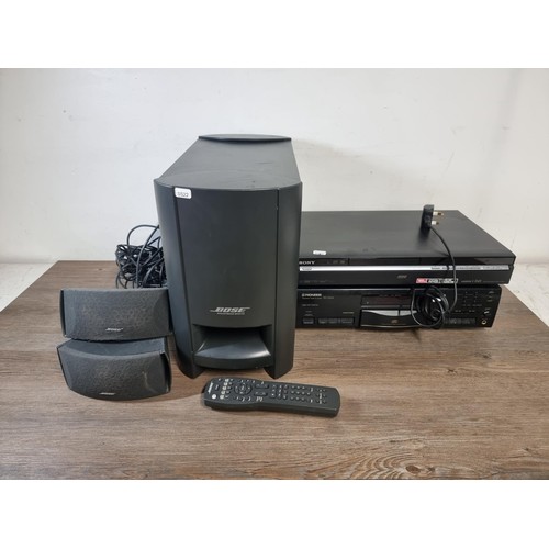 707 - Three items, one Bose CineMate digital home theatre speaker system comprising subwoofer and two sate... 