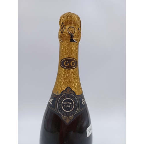 595 - A mid 20th century bottle of George Goulet extra dry Champagne sparkling wine - ABV not stated, pres... 