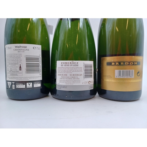 599 - Three 75cl bottles of sparkling wine, one Waitrose brut Champagne - bottled at 12.5%, one Bredon bru... 