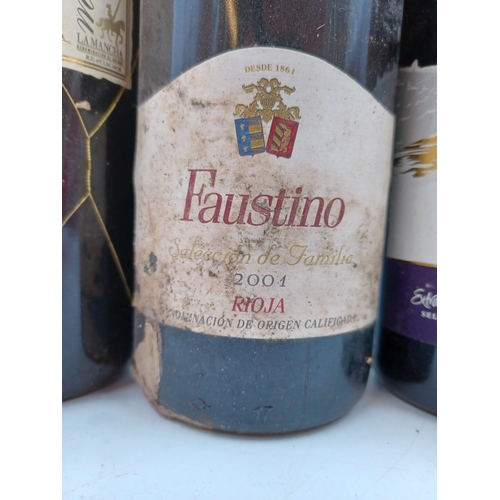 623 - Four 75cl bottles of red wine, one Portuguese 2013 Dão, one Spanish 2001 Faustino Selección de Famil... 