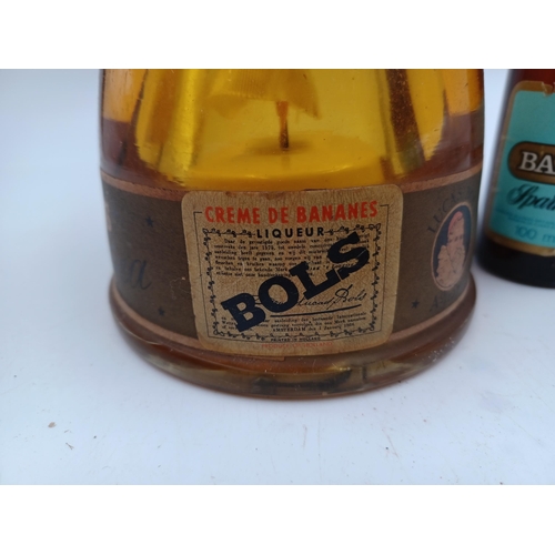 573 - Two items, one mid 20th century bottle of Bols Crème de Bananes liqueur in ballerina bottle - ABV no... 