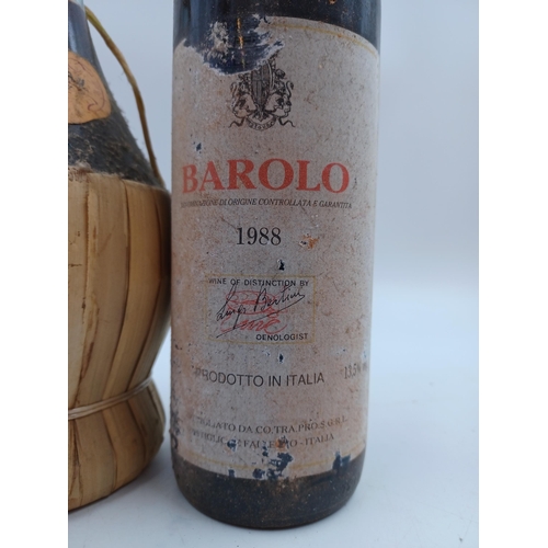 620 - Two 75cl bottles of Italian D.O.C.G. red wine, one 1988 Luigi Bertini Barolo and one fiasco of 1994 ... 