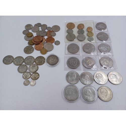 1230 - A collection of coins to include 90% silver American 1883 'Morgan' dollar, four 50% silver half crow... 