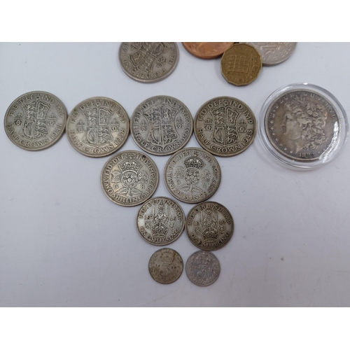 1230 - A collection of coins to include 90% silver American 1883 'Morgan' dollar, four 50% silver half crow... 