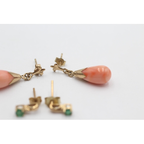 1002 - Two pairs of 9ct gold drop earrings, one coral and one emerald - approx. gross weight 2.5 grams