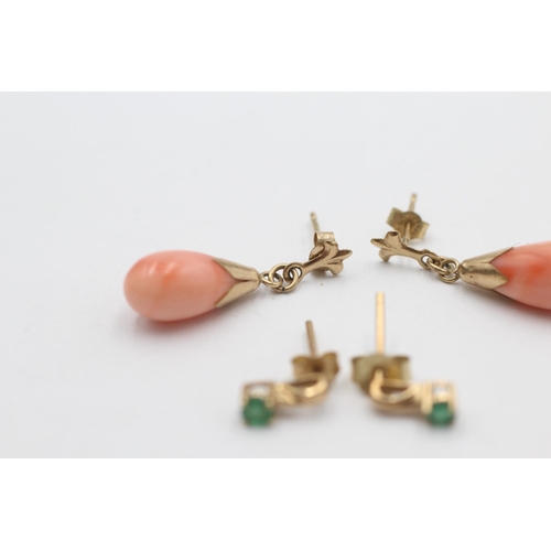 1002 - Two pairs of 9ct gold drop earrings, one coral and one emerald - approx. gross weight 2.5 grams