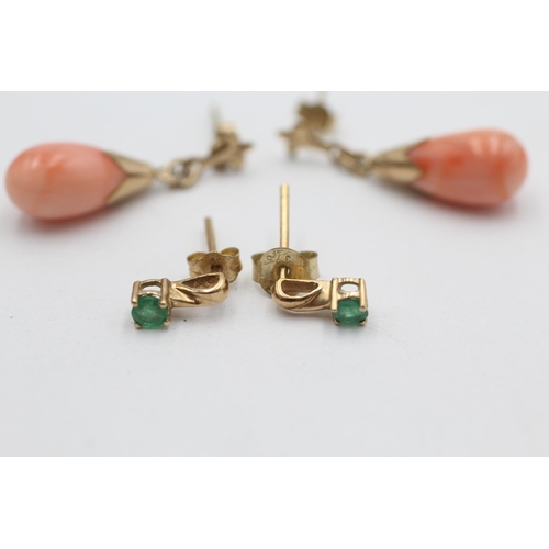 1002 - Two pairs of 9ct gold drop earrings, one coral and one emerald - approx. gross weight 2.5 grams