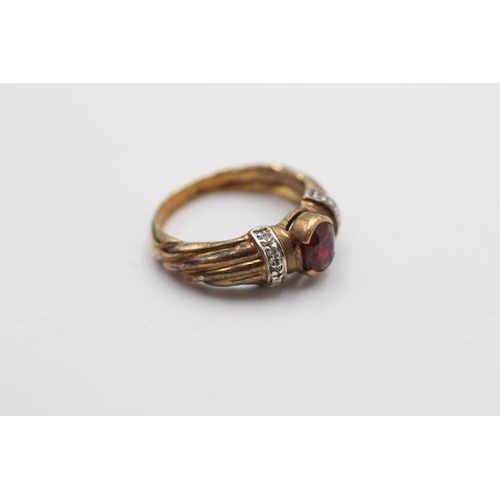 1003 - A 9ct gold ruby and diamond dress ring, size N - approx. gross weight 3.8 grams