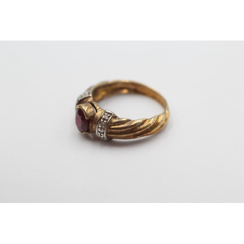 1003 - A 9ct gold ruby and diamond dress ring, size N - approx. gross weight 3.8 grams