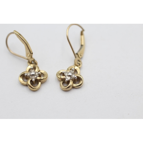 1008 - A pair of 10ct gold diamond set floral drop earrings - approx. gross weight 2.1 grams