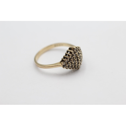 1011 - A 9ct gold diamond cluster ring, size M½ - approx. gross weight 2.2 grams