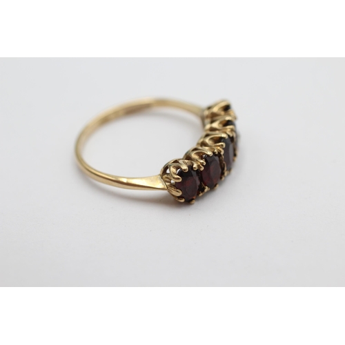 1012 - A 9ct gold garnet gypsy setting ring, size Q½ - approx. gross weight 2.7 grams