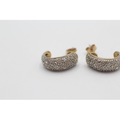 1020 - A pair of 9ct gold diamond half-hoop earrings - approx. gross weight 2.2 grams